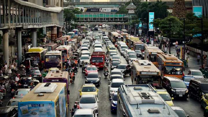 A heavily congested urban street scene showing dense traffic among buildings in a major city center.