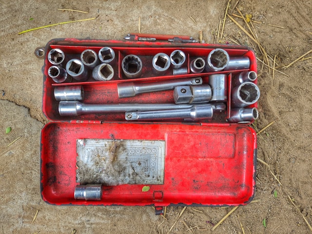 A tool box with some socket wrenches in it