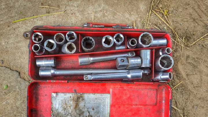 A tool box with some socket wrenches in it